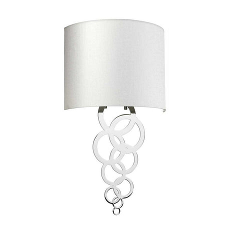 The Curtis Medium Wall Light - Polished Chrome showcases a large white cylindrical shade complemented by interlocking chrome rings, creating a contemporary design. With its polished chrome accents, this modern fixture brings a sleek and stylish appeal to any space.