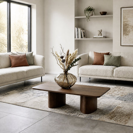 Dahukeng Vase 28cm in brown tinted ribbed glass with a wide rounded body and flared rim, styled with dried foliage on a wooden coffee table between two cream sofas.