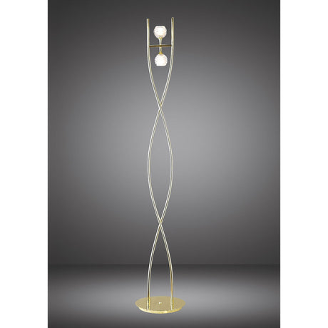 The Dali 2 Light Floor Lamp - Polished Brass features two twisted rods intersecting from a gold base, each holding a spherical white light fixture, strikingly set against a dark gray background.