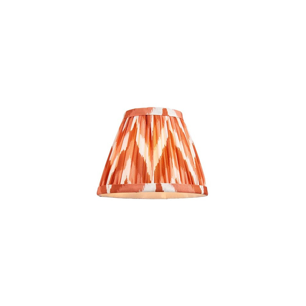 Daneton 16cm tapered lamp shade in apricot orange, pleated faux silk fabric with zigzag pattern and taped edges, shown on a plain white background.