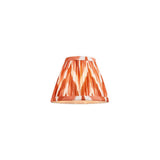 Daneton 16cm tapered lamp shade in apricot orange, pleated faux silk fabric with zigzag pattern and taped edges, shown on a plain white background.
