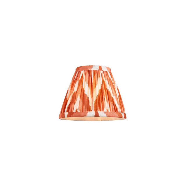 Daneton 16cm tapered lamp shade in apricot orange, pleated faux silk fabric with zigzag pattern and taped edges, shown on a plain white background.