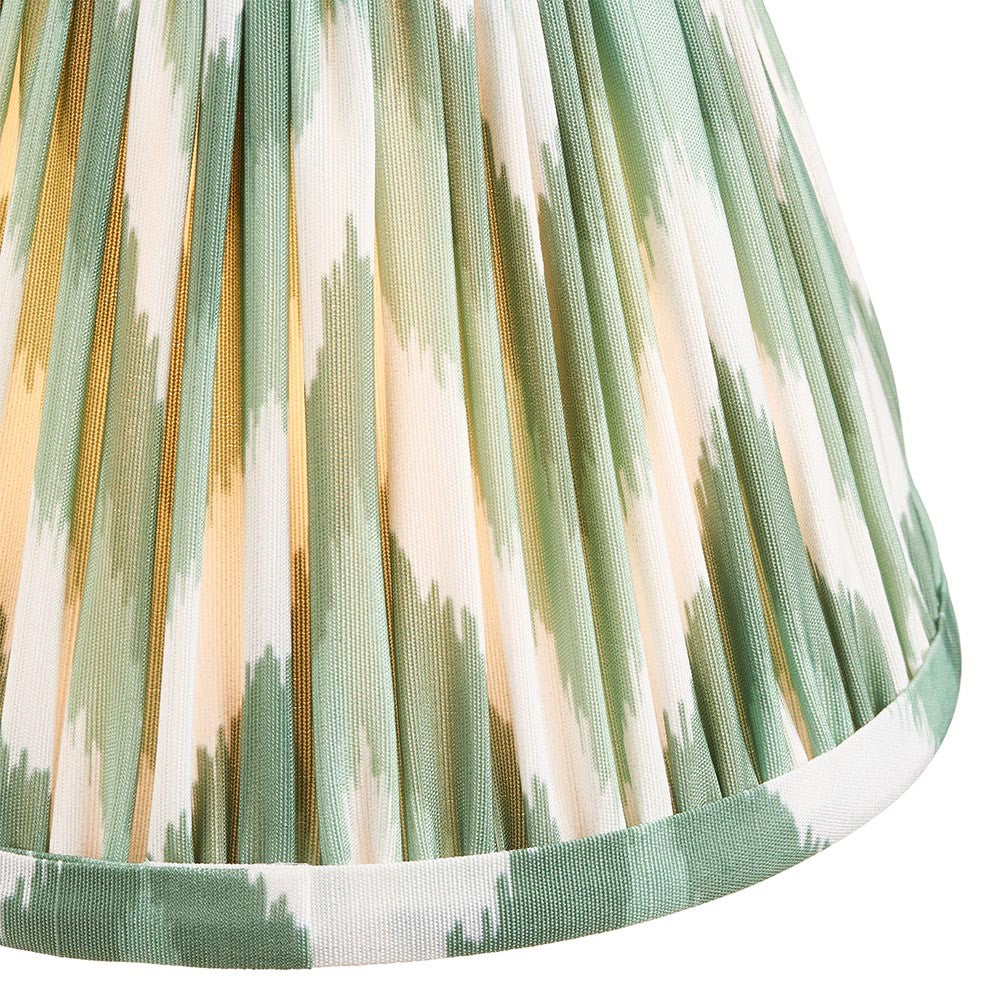Endon Daneton 16cm tapered lamp shade in Cotswold green, close-up of pleated faux silk with green and cream zigzag print and taped edge trim.