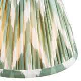Endon Daneton 16cm tapered lamp shade in Cotswold green, close-up of pleated faux silk with green and cream zigzag print and taped edge trim.