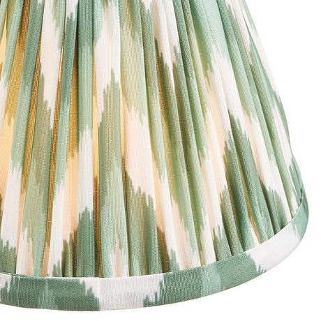 Endon Daneton 16cm tapered lamp shade in Cotswold green, close-up of pleated faux silk with green and cream zigzag print and taped edge trim.