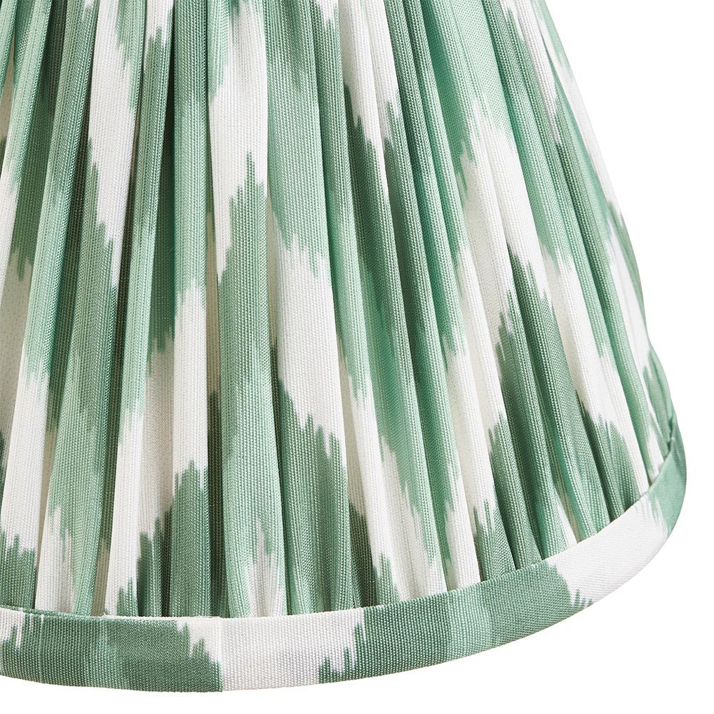 Endon Daneton 16cm tapered lamp shade in Cotswold green, close-up of the pleated faux silk with green and white zigzag print and taped edge trim.