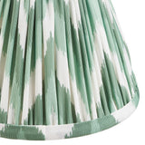 Endon Daneton 16cm tapered lamp shade in Cotswold green, close-up of the pleated faux silk with green and white zigzag print and taped edge trim.