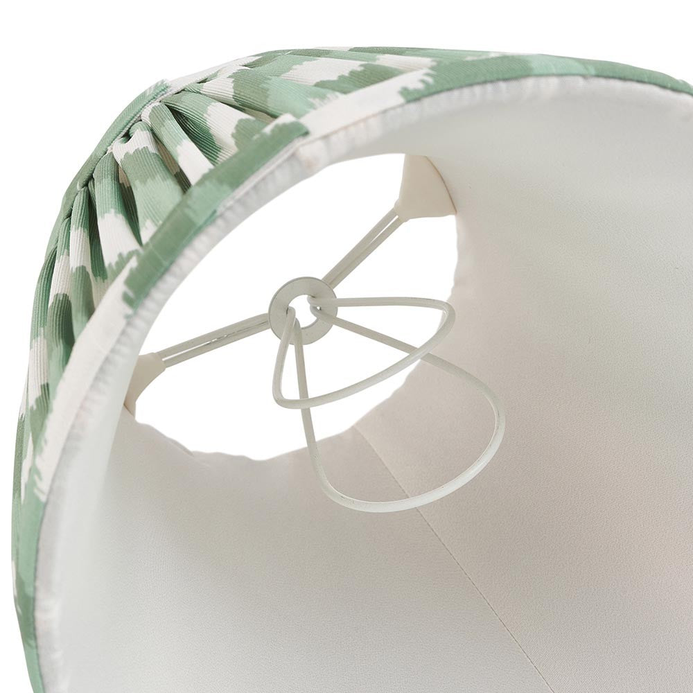 Interior view of Endon Daneton 16cm tapered lamp shade in Cotswold green faux silk, showing pleated zigzag print, taped edge and white candle clip fitting.