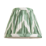 Endon Daneton 16cm tapered lamp shade in Cotswold green faux silk with a white zigzag print, pleated finish and taped edges, on a white background.
