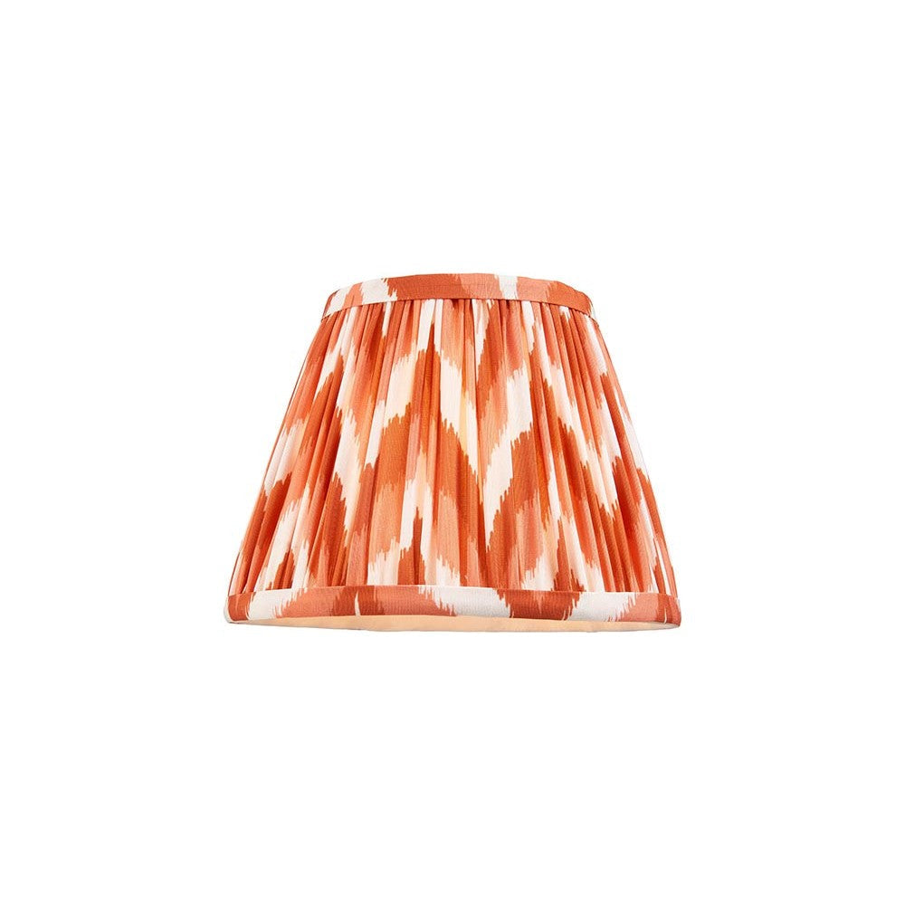 Endon Daneton 20cm tapered lamp shade in apricot orange and white zigzag pleated faux silk with taped edge, shown on a plain white background.