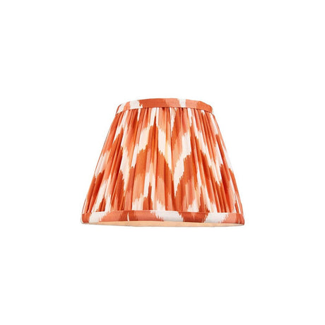 Endon Daneton 20cm tapered lamp shade in apricot orange and white zigzag pleated faux silk with taped edge, shown on a plain white background.
