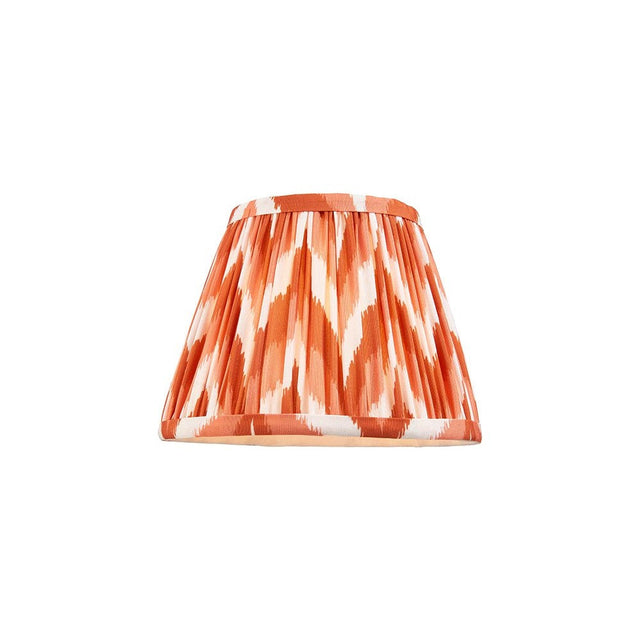 Endon Daneton 20cm tapered lamp shade in apricot orange and white zigzag pleated faux silk with taped edge, shown on a plain white background.