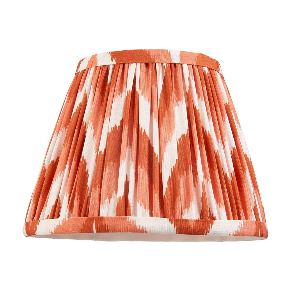 Endon Daneton 20cm tapered lamp shade in apricot orange and white zigzag pleated faux silk with taped edge trim, shown on a plain white background.