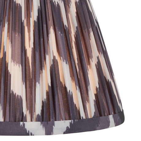 Endon Daneton 20cm tapered lamp shade in pearl grey pleated faux silk, close-up showing the zigzag print and taped edge trim.