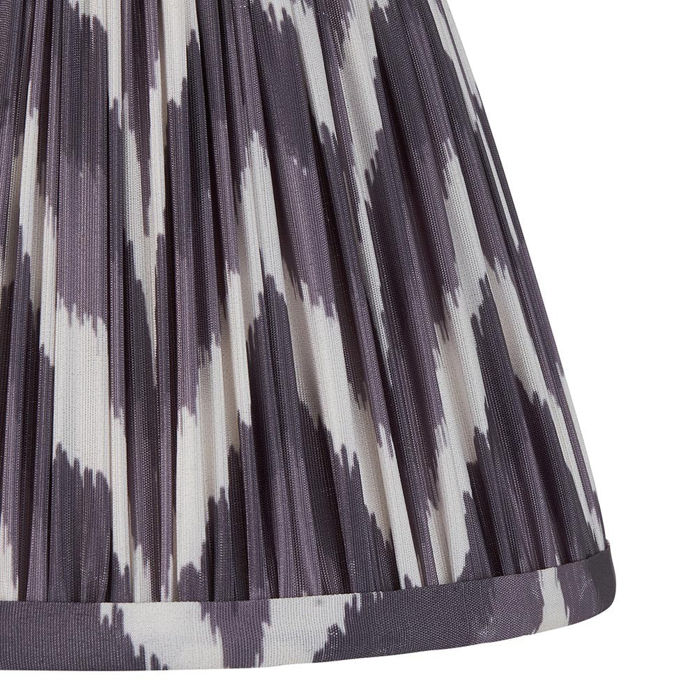 Close-up of the Endon Daneton 20cm tapered lamp shade in pearl grey, showing pleated faux silk with a zigzag print and taped edge trim.