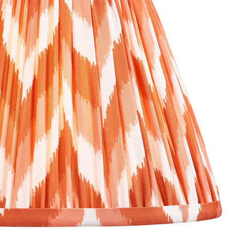 Endon Daneton 25cm tapered lamp shade in pleated faux silk with an apricot orange and white zigzag print and taped edge trim.