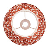 Endon Daneton 25cm tapered lamp shade in apricot orange zigzag pleated faux silk, viewed from above showing gimbal fitting and white inner lining.
