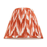 Endon Daneton 25cm tapered lamp shade in apricot orange and white pleated faux silk with zigzag print and taped edges, on a plain white background.