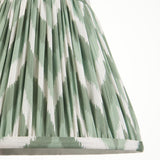 Endon Daneton 25cm tapered lamp shade in Cotswold green and white zigzag-print pleated faux silk, shown close-up against a plain light background.