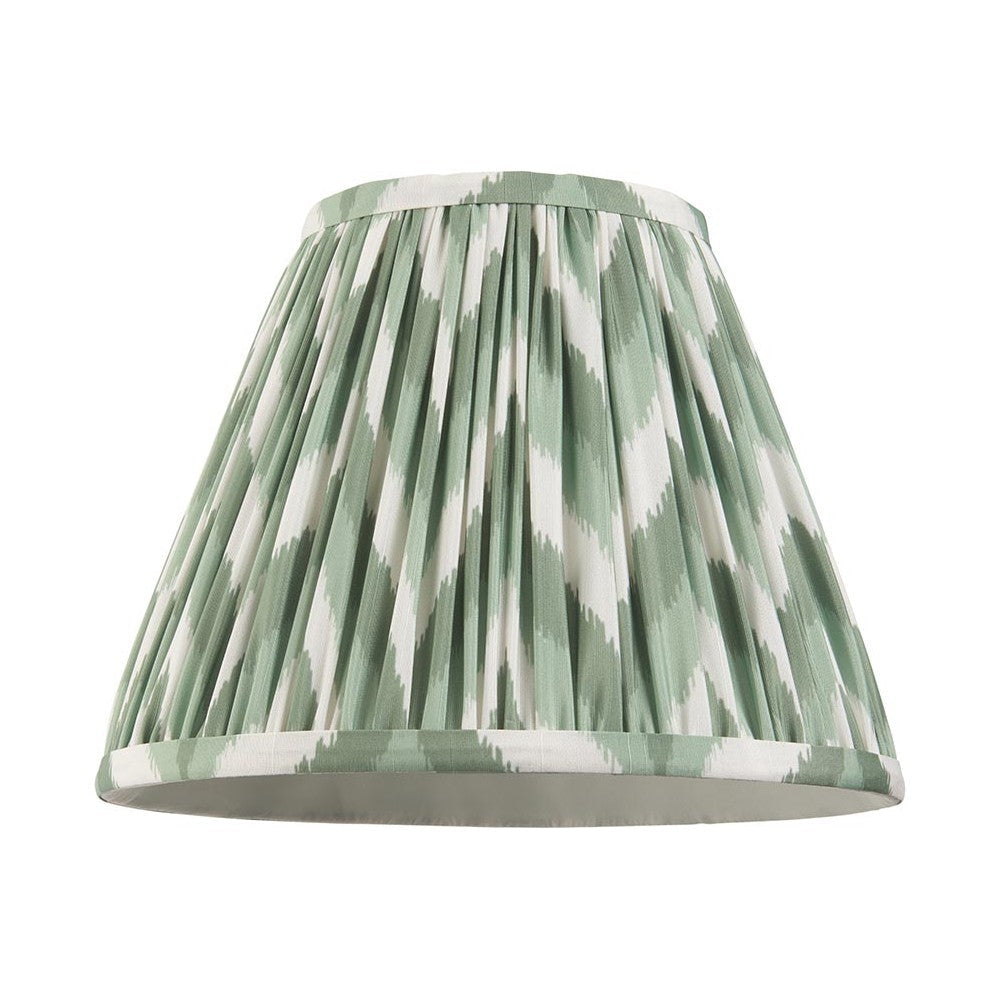 Endon Daneton 25cm tapered lamp shade in Cotswold green and white zigzag pleated faux silk with taped edges, shown on a plain white background.