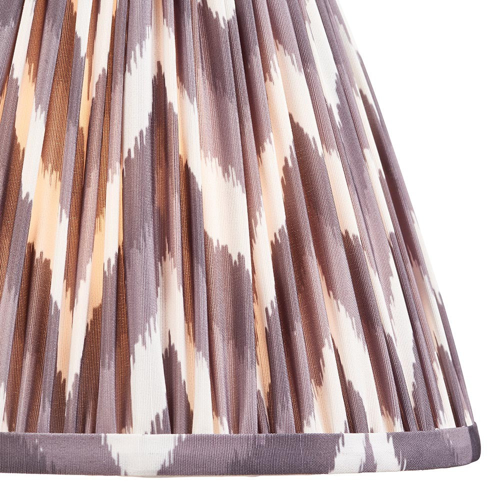 Endon Daneton 25cm tapered lamp shade in pearl grey pleated faux silk with a zigzag print and taped edge detailing, shown in close-up.