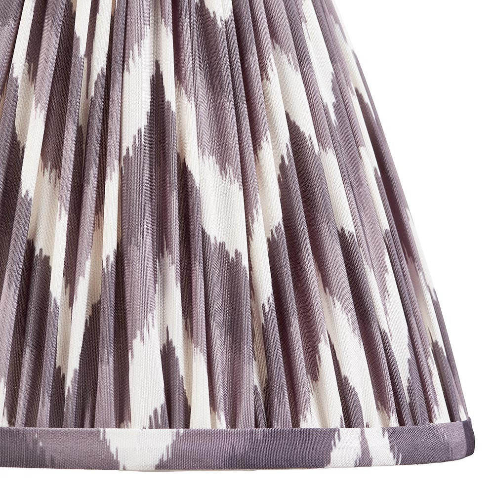 Close-up of Endon Daneton 25cm tapered lamp shade in pearl grey pleated faux silk with a zigzag print and taped edge detailing.