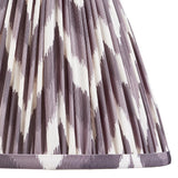 Close-up of Endon Daneton 25cm tapered lamp shade in pearl grey pleated faux silk with a zigzag print and taped edge detailing.