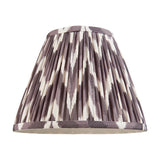 Endon Daneton 25cm tapered lamp shade in pleated faux silk with a pearl grey and white zigzag print, taped edges and gimbal fitting, on a white background.