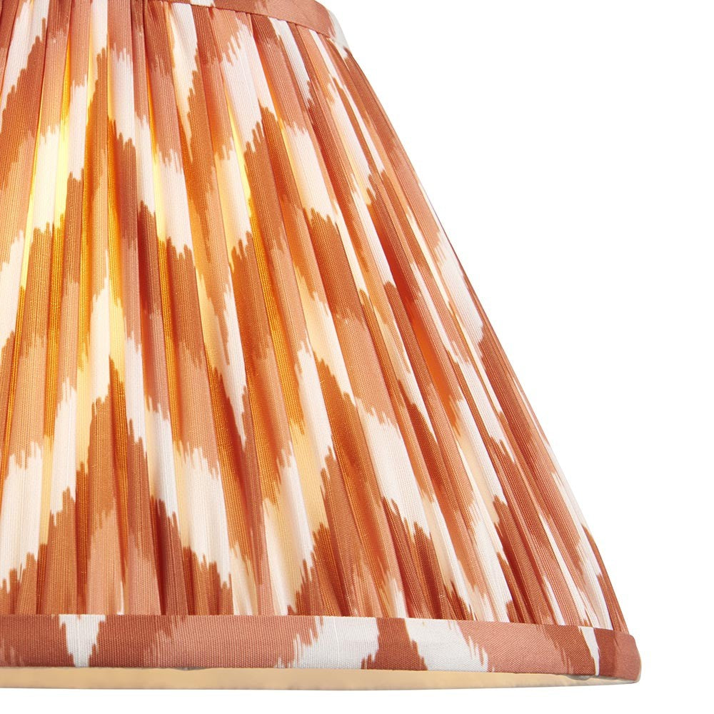 Endon Daneton 30cm tapered lamp shade in pleated faux silk with an apricot orange and white zigzag print and taped edge detailing.