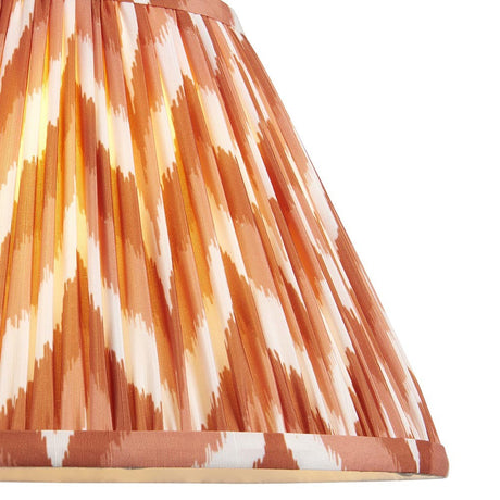Endon Daneton 30cm tapered lamp shade in pleated faux silk with an apricot orange and white zigzag print and taped edge detailing.