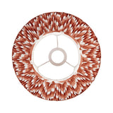 Top-down view of the Endon Daneton 30cm tapered lamp shade in apricot orange with a white zigzag print, pleated faux silk and fixed gimbal fitting.