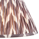 Close-up of Endon Daneton 30cm tapered lamp shade in pearl grey, showing pleated faux silk with a zigzag print and taped edge detailing.