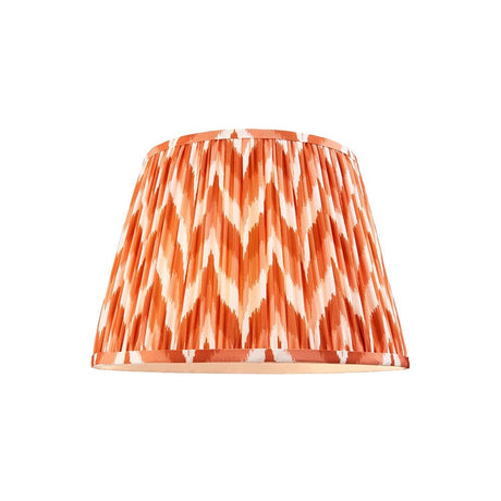 Endon Daneton 35cm tapered lamp shade in apricot orange and white zigzag pleated faux silk with taped edges, shown on a plain white background.