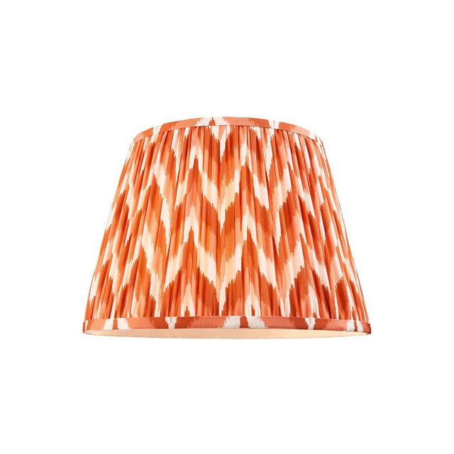 Endon Daneton 35cm tapered lamp shade in apricot orange and white zigzag pleated faux silk with taped edges, shown on a plain white background.