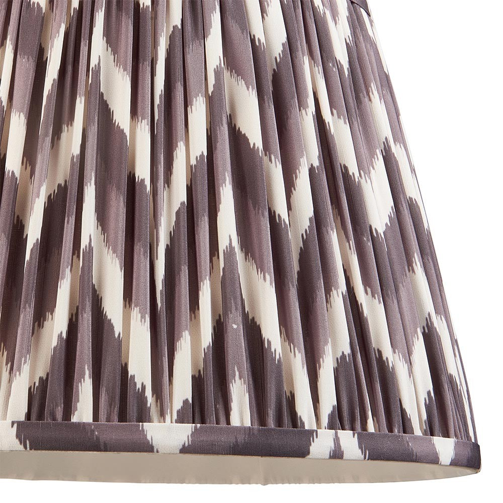 Endon Daneton 35cm tapered lamp shade in pearl grey pleated faux silk with a zigzag print and taped edge detailing, shown close-up.