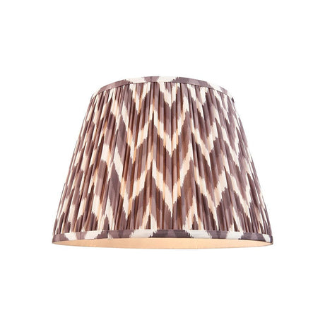 Endon Daneton 40cm tapered lamp shade in pearl grey pleated faux silk with a white and grey zigzag print and taped edges, on a white background.