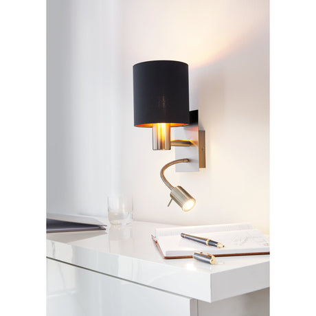 Dernessa LED Wall Light with black fabric drum shade and copper lining on a satin nickel base, plus a flexible reading arm, shown mounted above a desk.
