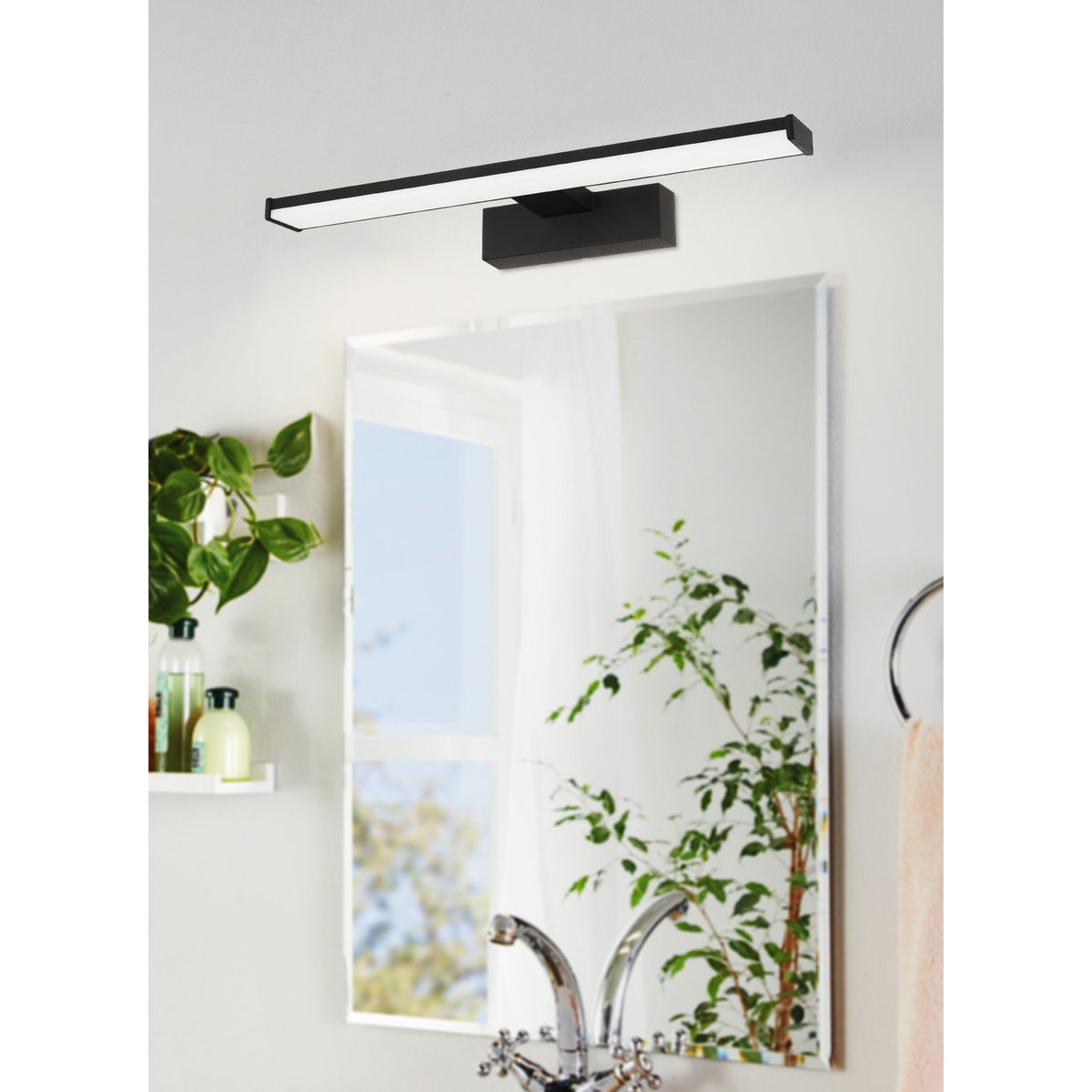 Dervette LED Bathroom Wall Light 40cm in black, mounted above a mirror, showing the slim bar with white diffuser and rectangular wall box in a bathroom setting.