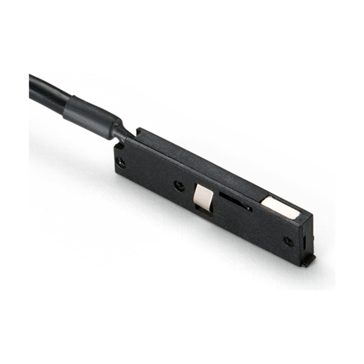 Deva 24V Track Power Feed in black, a slim rectangular connector with a black cable lead, screw fixing points, and metal contacts, shown on a plain white background.