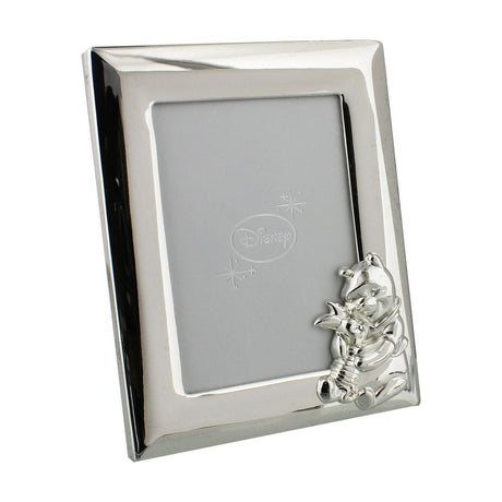 Silverplated Winnie the Pooh photo frame with wide bevelled silver border and moulded Pooh and Piglet figure in the corner, holding a 5 x 3.5in photo on a white background.
