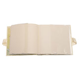 Classic Pooh My First Photos portrait album open to show cream pages with clear photo pockets and ribbon tie, on a plain white background.