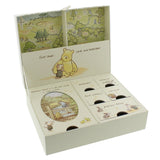Classic Pooh keepsake box in cream, open to show a Hundred Acre Wood map lid, Pooh and Piglet artwork, and labelled compartments for keepsakes, mittens, memories and precious things.