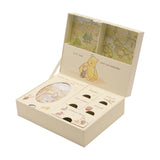 Cream rectangular Classic Pooh keepsake box, opened to show labelled compartments for first shoes, mittens, keepsakes and cards, illustrated with Pooh and Piglet on a plain background.