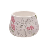 Round white ceramic trinket box with pencil-sketch Thumper rabbit, pink florals and green leaves, speckled gloss finish, shown without lid on a plain background.