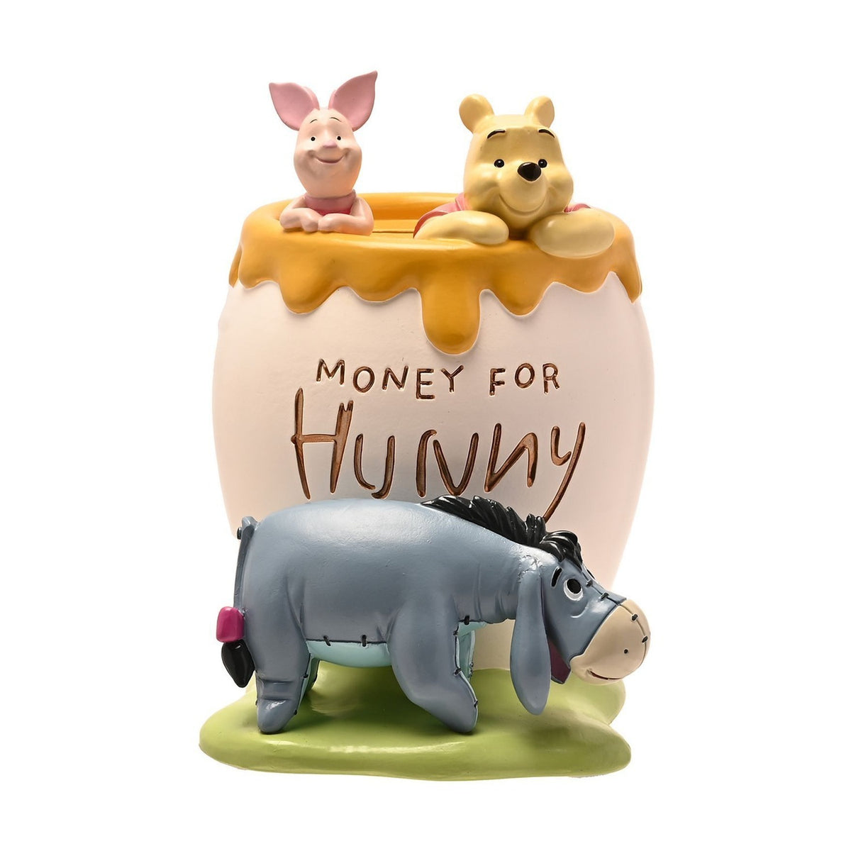 White resin honey pot money box with dripping yellow trim, Winnie the Pooh and Piglet peeking over the rim, Eeyore on grass below, engraved Money for Hunny text, on a plain white background.
