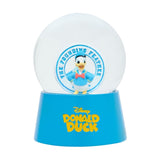 Resin snow globe with a Donald Duck sailor figure in blue cap and red bow tie inside a clear dome, set on a blue base reading "Disney Donald Duck," plain white background.
