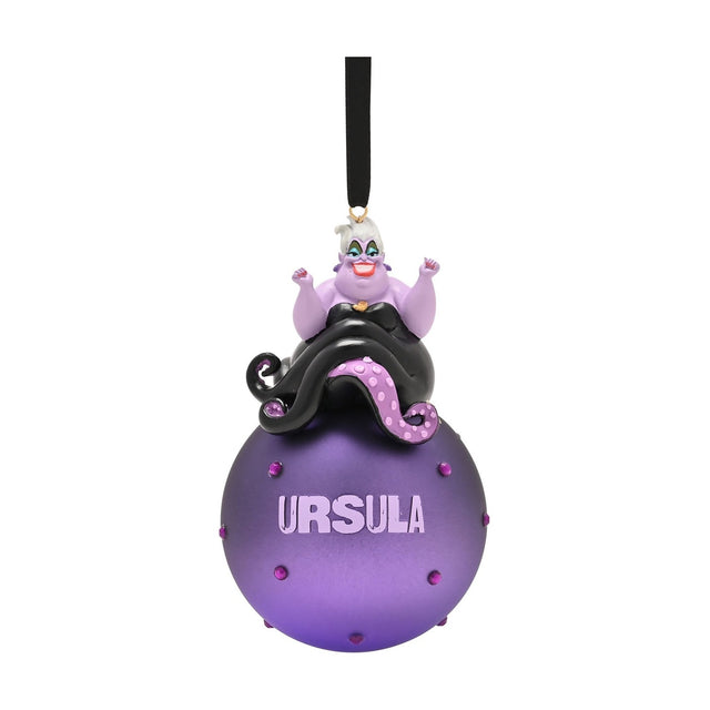Ursula figurine with arms raised atop a round purple glass bauble studded with dots and lettered "URSULA", black tentacles draping down, black ribbon hanger, on a white background.