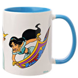 White stoneware mug with light blue handle and interior, featuring Jasmine stretched across a purple, gold, red and blue flying carpet beside a figure holding a golden lamp.