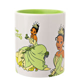 White stoneware Tiana mug with lime green interior and handle, featuring Tiana seated with a frog and standing in a gown, "Disney Princess" text, on a plain background.