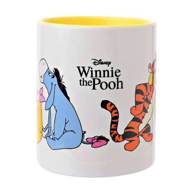 White stoneware mug, 325ml, with yellow interior, featuring printed Winnie the Pooh, Eeyore and Tigger characters and Disney logo text, shown on a plain white background.